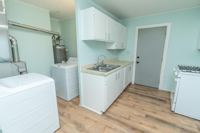 laundry room featuring gas water heater, ornamental molding, washer / clothes dryer, and a sink