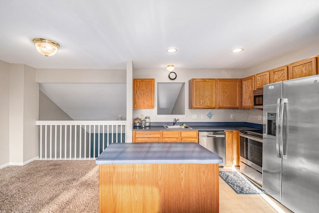 kitchen featuring light carpet, a sink, a kitchen island, recessed lighting, and appliances with stainless steel finishes