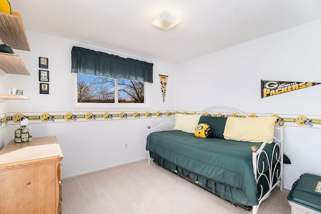 carpeted bedroom with baseboards