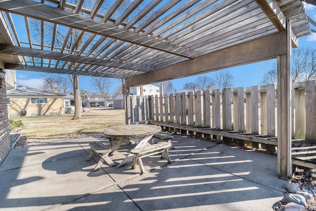 view of patio featuring fence and a pergola