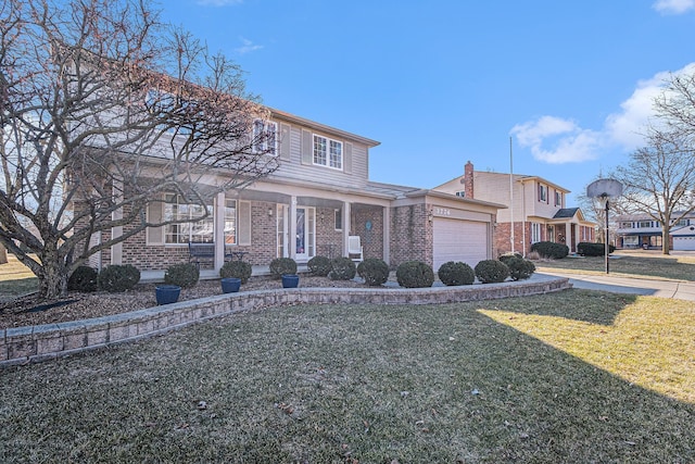 view of front of property with a garage, driveway, brick siding, and a front yard