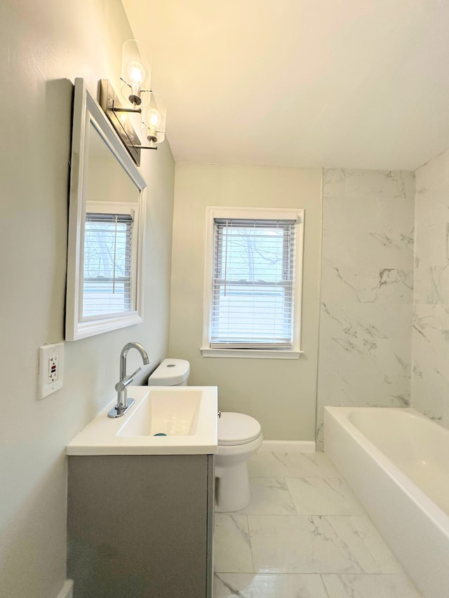 full bath with vanity, toilet, marble finish floor, and a wealth of natural light