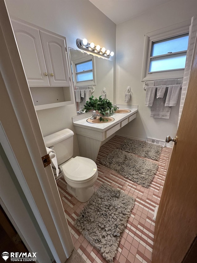 bathroom with a sink and toilet