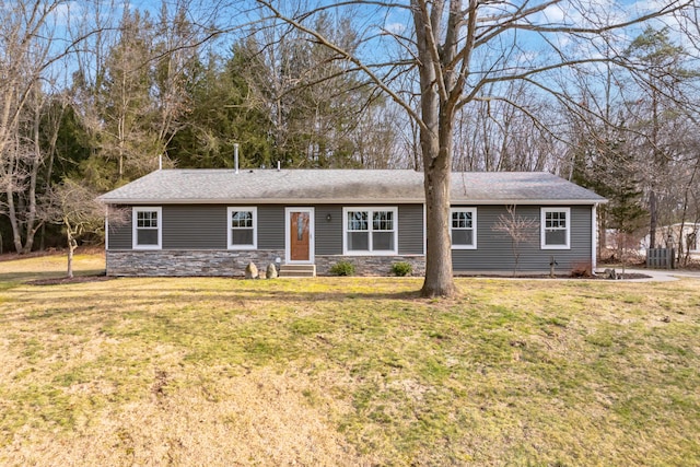 single story home with stone siding, a front lawn, and entry steps