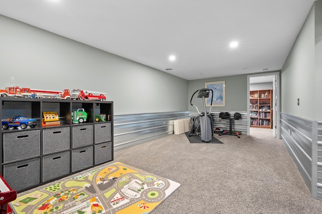 playroom featuring recessed lighting, a wainscoted wall, and carpet flooring