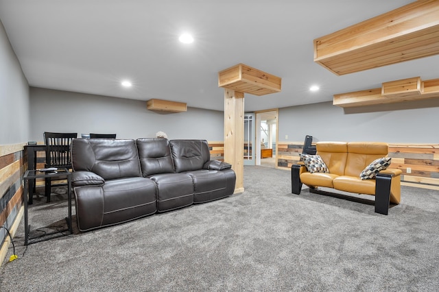 carpeted living area featuring recessed lighting and wainscoting