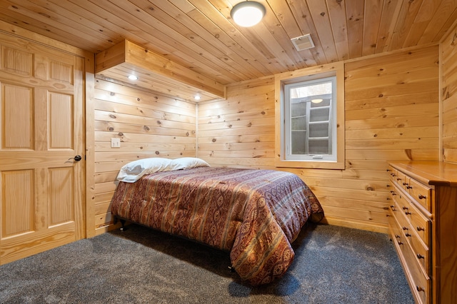 carpeted bedroom featuring wooden walls and wood ceiling