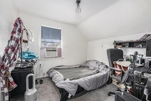 bedroom with cooling unit, carpet floors, and vaulted ceiling