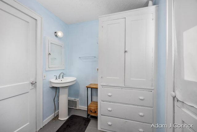 bathroom with visible vents and a sink