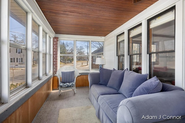 sunroom / solarium featuring wood ceiling