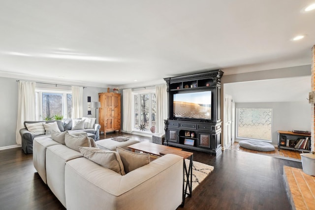 living area featuring recessed lighting, baseboards, and dark wood finished floors