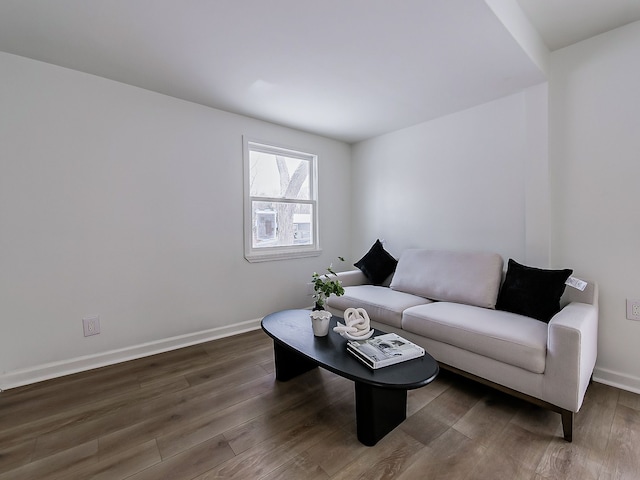 living area featuring wood finished floors and baseboards