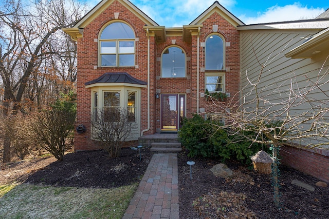 view of front of house with brick siding