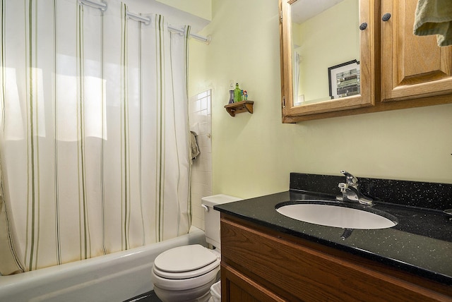 bathroom featuring vanity, toilet, and shower / bath combo