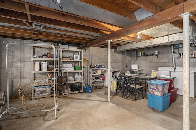 unfinished below grade area featuring visible vents and independent washer and dryer