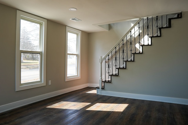 stairs with visible vents, recessed lighting, baseboards, and wood finished floors