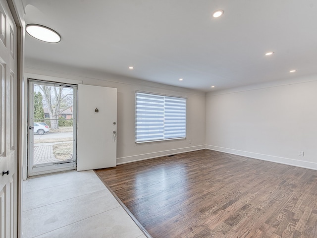 foyer entrance featuring recessed lighting, baseboards, and wood finished floors