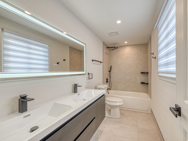 bathroom with tile patterned floors, toilet, recessed lighting, and a sink