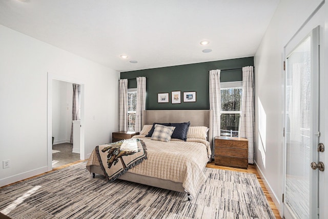 bedroom featuring recessed lighting, light wood-style floors, and baseboards