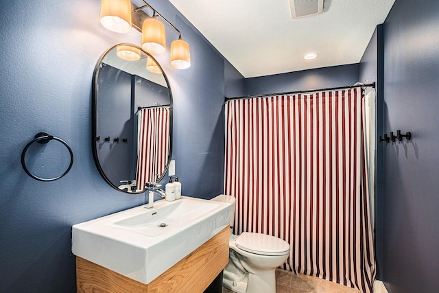 full bath featuring vanity, tile patterned floors, toilet, and visible vents