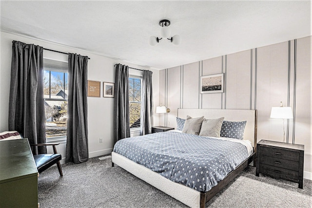 bedroom featuring carpet flooring and baseboards