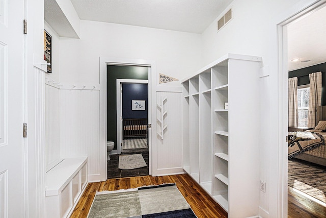 mudroom with visible vents and wood finished floors