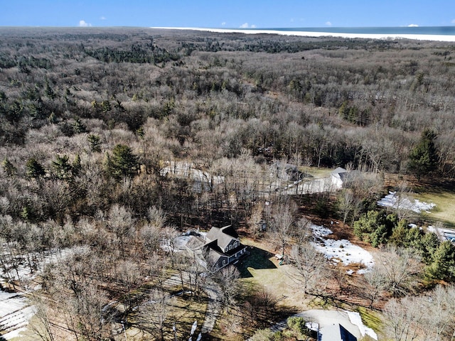 birds eye view of property featuring a wooded view