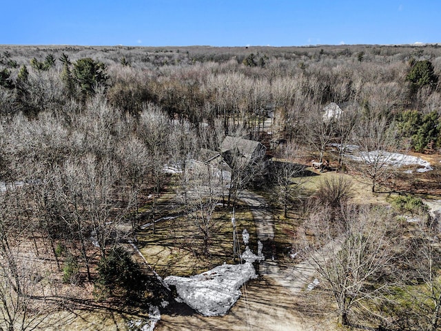 birds eye view of property with a wooded view