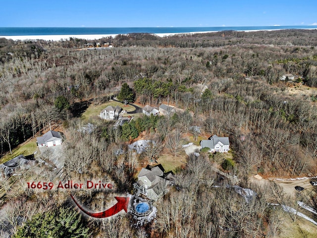 birds eye view of property featuring a water view