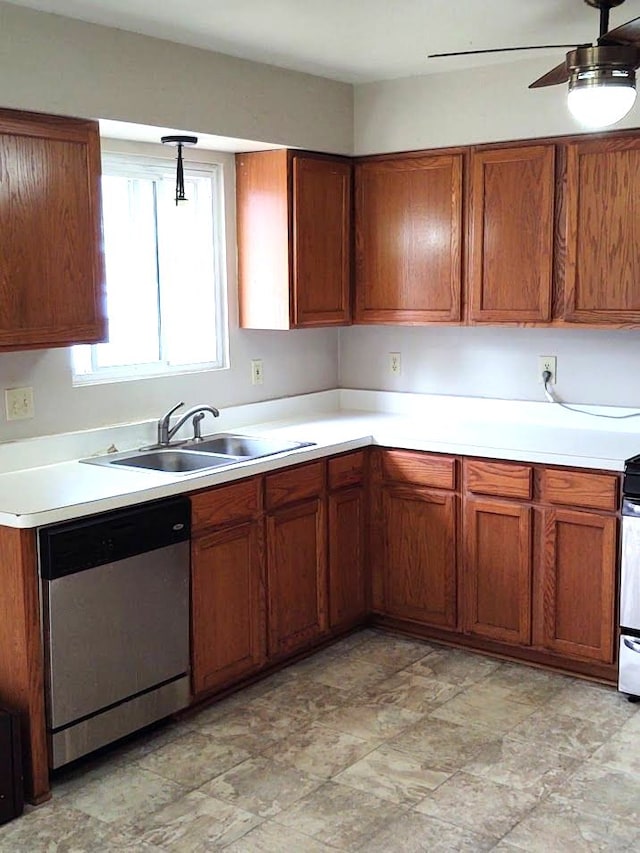 kitchen featuring a sink, brown cabinets, light countertops, and stainless steel dishwasher