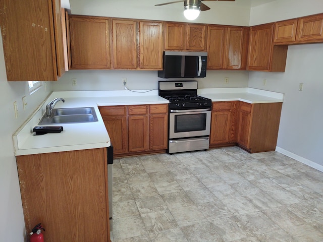 21641 Jacksonville St, Farmington Hills, MI 48336 - kitchen featuring brown cabinets, stainless steel appliances, a ceiling fan, and a sink