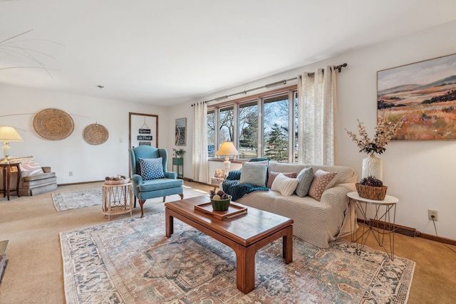 living area featuring carpet and baseboards