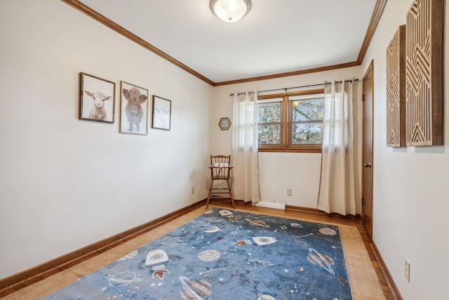 spare room featuring baseboards and ornamental molding