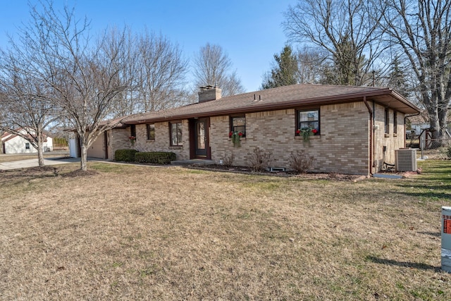 ranch-style home featuring brick siding, a front lawn, concrete driveway, a chimney, and a garage