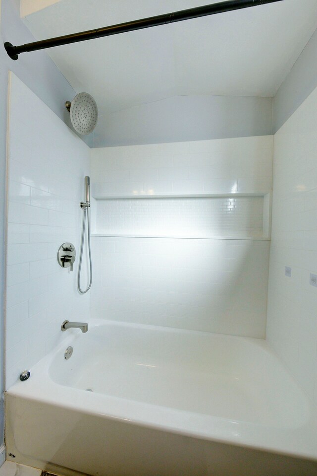 bathroom with bathing tub / shower combination