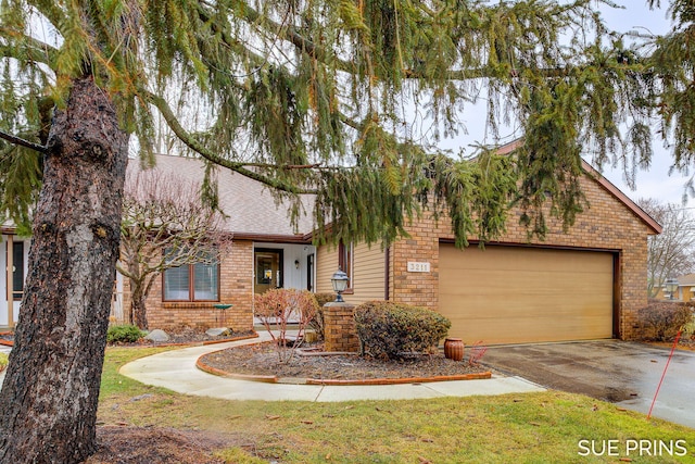 view of front of home featuring a garage, brick siding, driveway, and roof with shingles