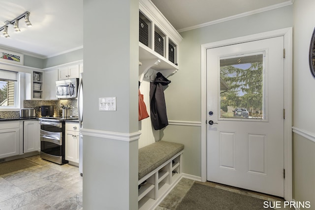 mudroom with stone finish floor and ornamental molding