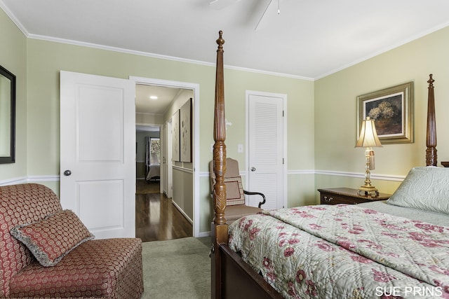 carpeted bedroom with crown molding and ceiling fan