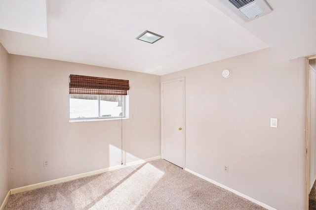 unfurnished bedroom featuring visible vents, carpet floors, and baseboards