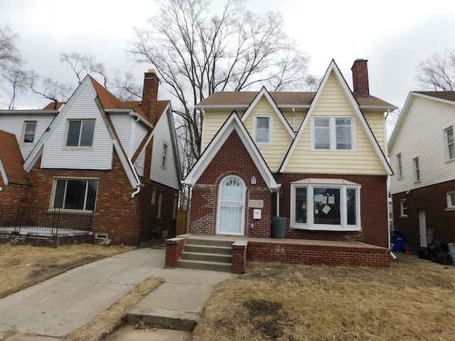 18978 Prairie St, Detroit, MI 48221 - tudor home featuring brick siding and a chimney
