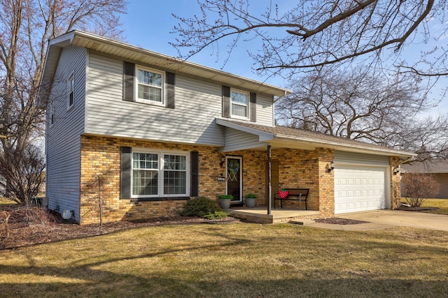 view of front of house with brick siding, a front yard, an attached garage, and driveway