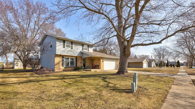 traditional-style home with a garage, brick siding, concrete driveway, and a front yard