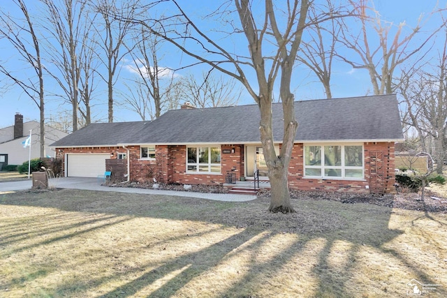 ranch-style home featuring a garage, brick siding, and roof with shingles