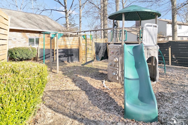 view of jungle gym with fence