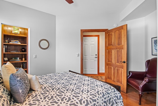 bedroom with ceiling fan and wood finished floors