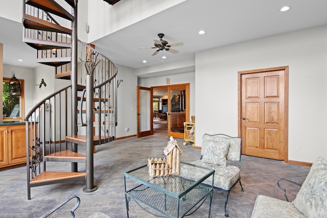 living area with stairs, recessed lighting, a ceiling fan, and baseboards