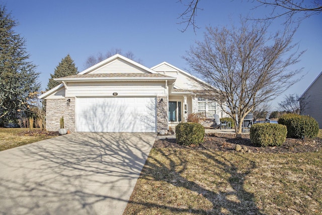 ranch-style house with a garage, stone siding, and driveway