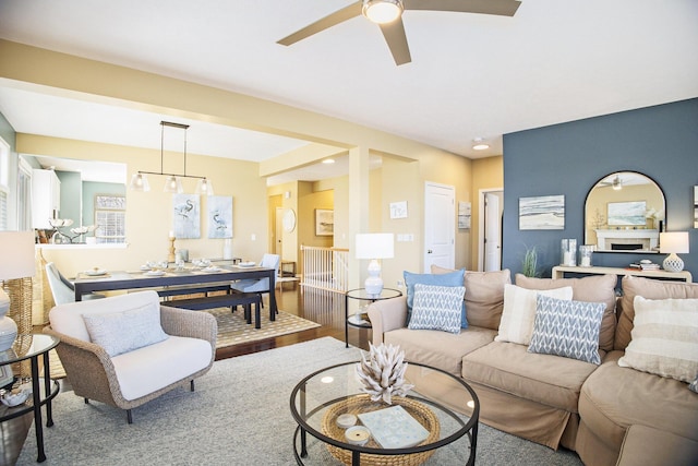 living room featuring wood finished floors, recessed lighting, a fireplace, and ceiling fan