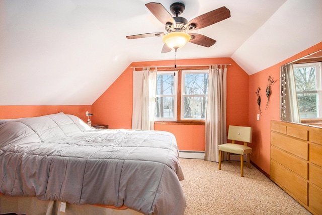 bedroom with light colored carpet, a baseboard heating unit, lofted ceiling, and ceiling fan