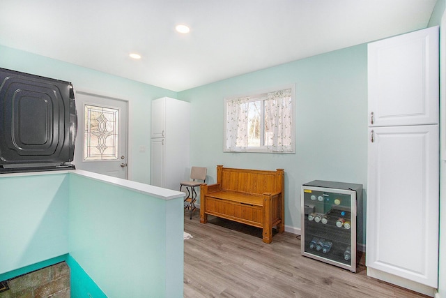 interior space with recessed lighting, light wood-type flooring, and wine cooler